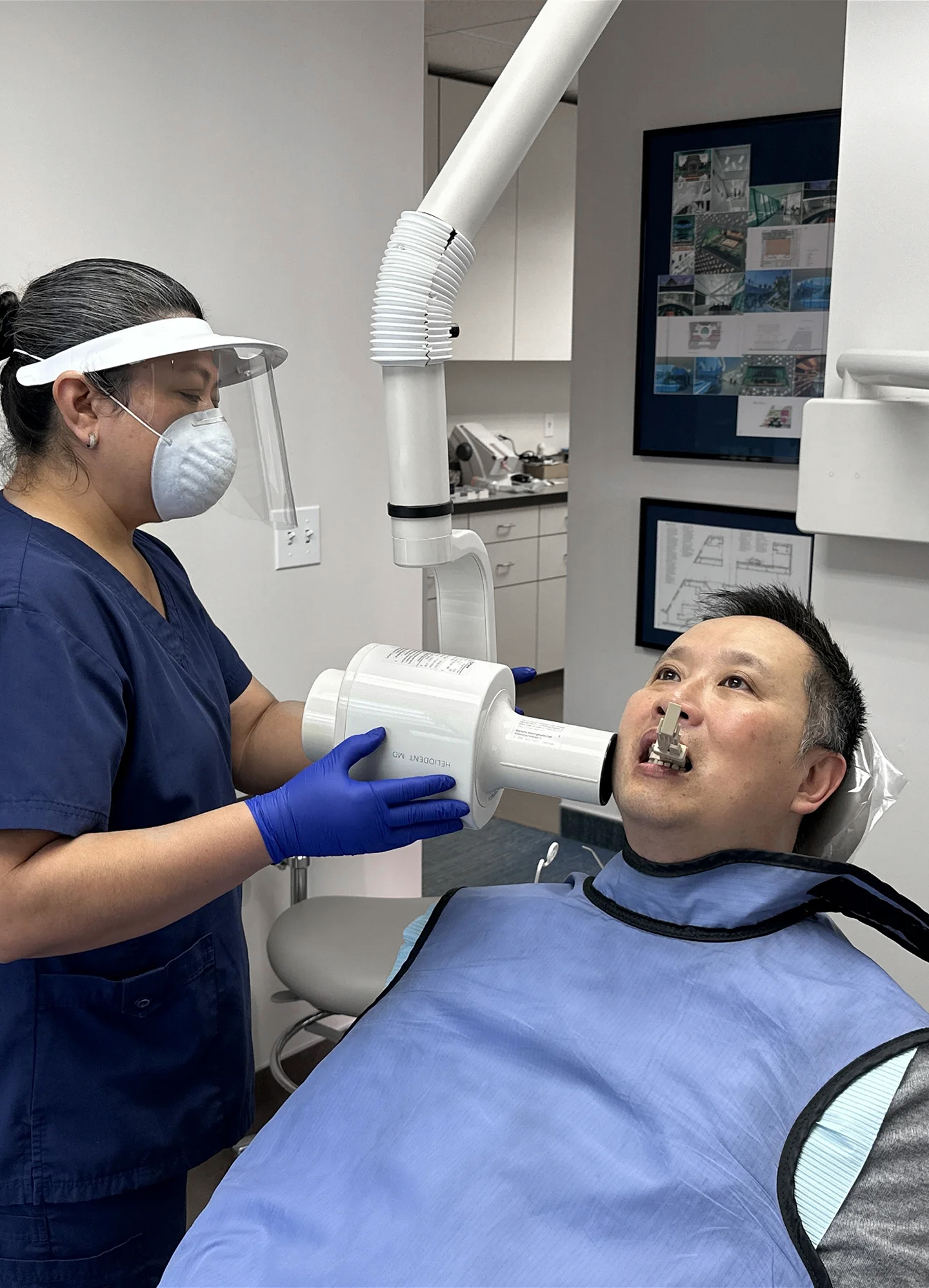 Dental hygienist performing thorough teeth cleaning